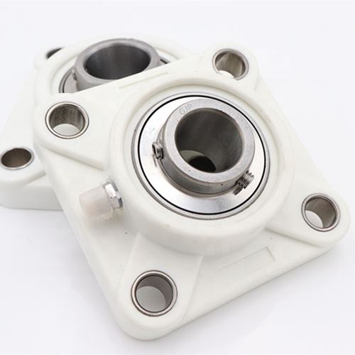 thermoplastic bearing block unit with stainless steel bearing inserts