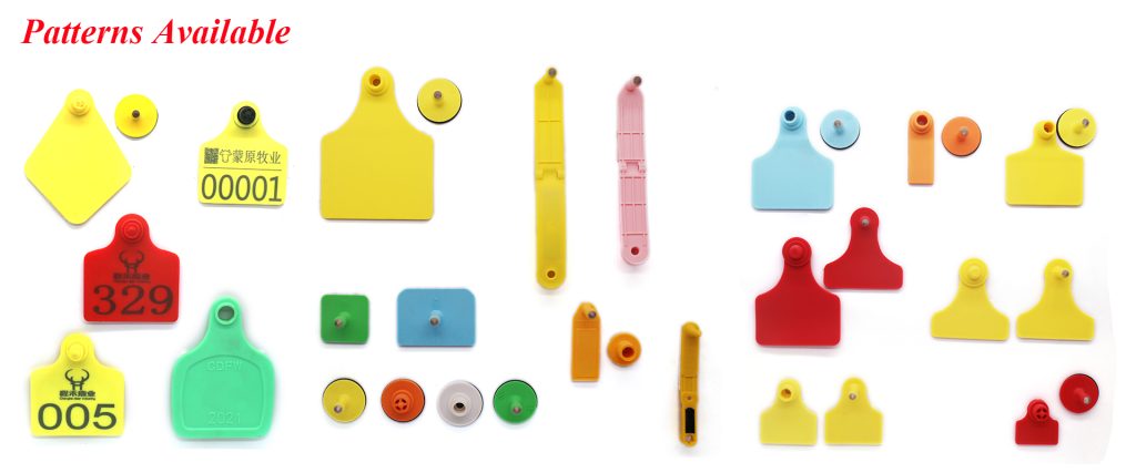 Various colorful livestock ear tags and buttons.