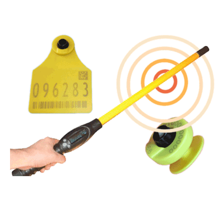 RFID wand scanning livestock ear tag for identification.